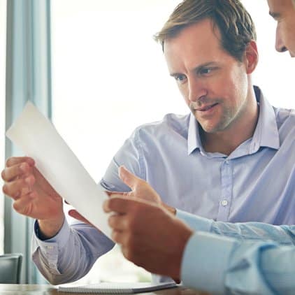 2 men going over a document