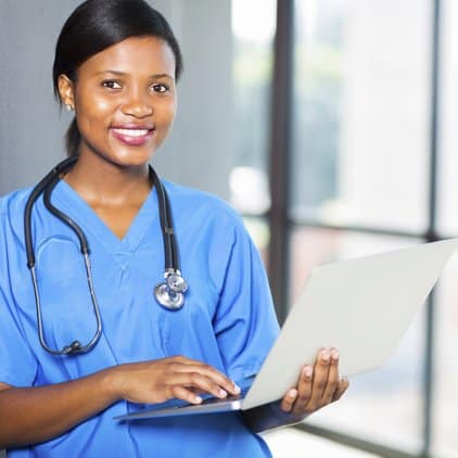 nurse holding laptop